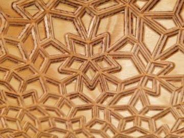 Wood-carved Penrose tiling by Teresa Hunyadi.